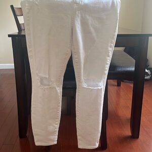 Brand new white jeans distressed on knee